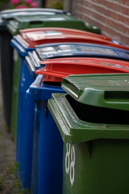 The image depicts a city street scene featuring a mix of historic and modern buildings, with the central focus on a white waste collection vehicle parked on the street. The vehicle, used for private r